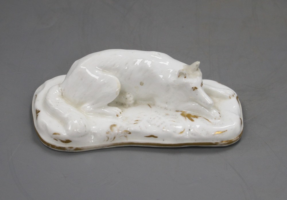 A Grainger Lee gilt and white porcelain figure of a recumbent Indian Hare dog, c. 1820-37, L. 11.1cm